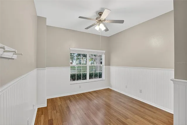 a bathroom with a walk in closet and a mirror