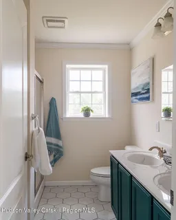 a bathroom with a sink a toilet and a mirror