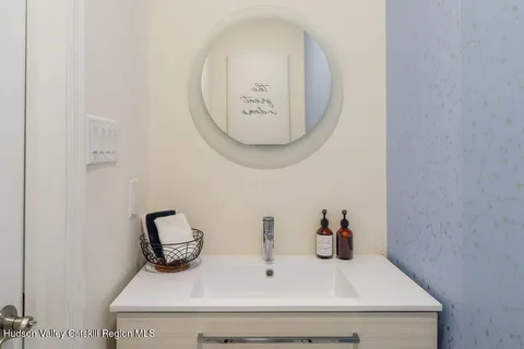 a bathroom with a sink and a mirror
