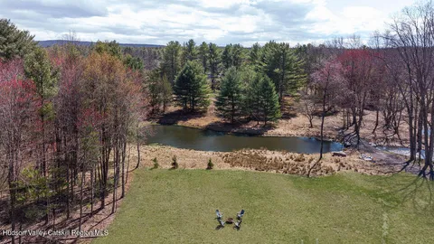 a view of lake with green space