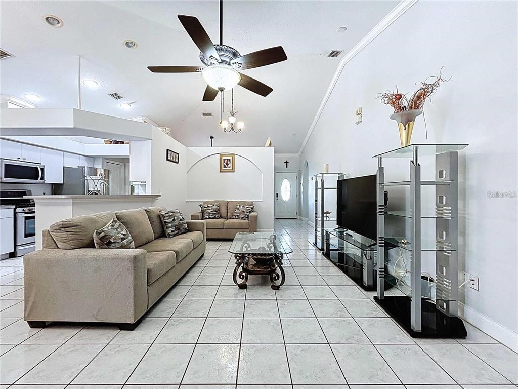 3324 West Abdella Street Tampa, FL 33607 - Photo 4 of 20 a living room with furniture and a flat screen tv