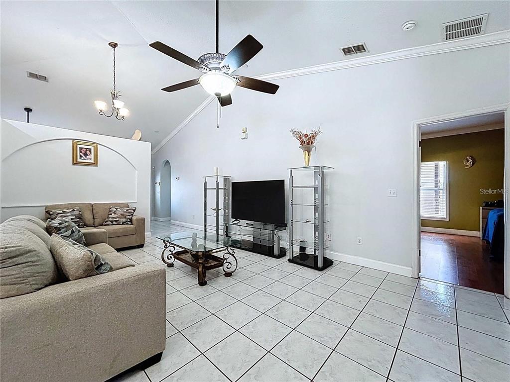 3324 West Abdella Street Tampa, FL 33607 - Photo 5 of 20 a living room with furniture and a flat screen tv