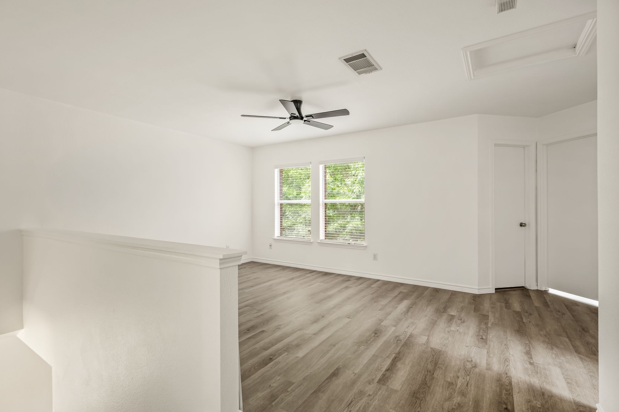 1408 Water Spaniel Way Round Rock, TX 78664 - Photo 18 of 37 A versatile upstairs loft with abundant natural light and durable wood flooring.
