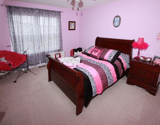 13523 Marigold Road Plainfield, IL 60544 - Photo 13 of 16 a bedroom with a bed and window