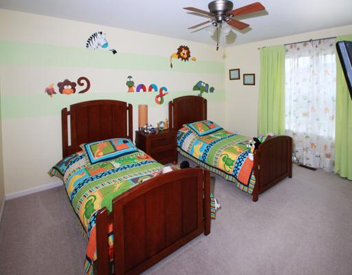13523 Marigold Road Plainfield, IL 60544 - Photo 14 of 16 a bedroom with two beds and a table