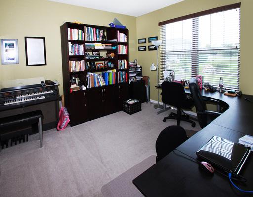 13523 Marigold Road Plainfield, IL 60544 - Photo 8 of 16 a room with furniture and a book shelf