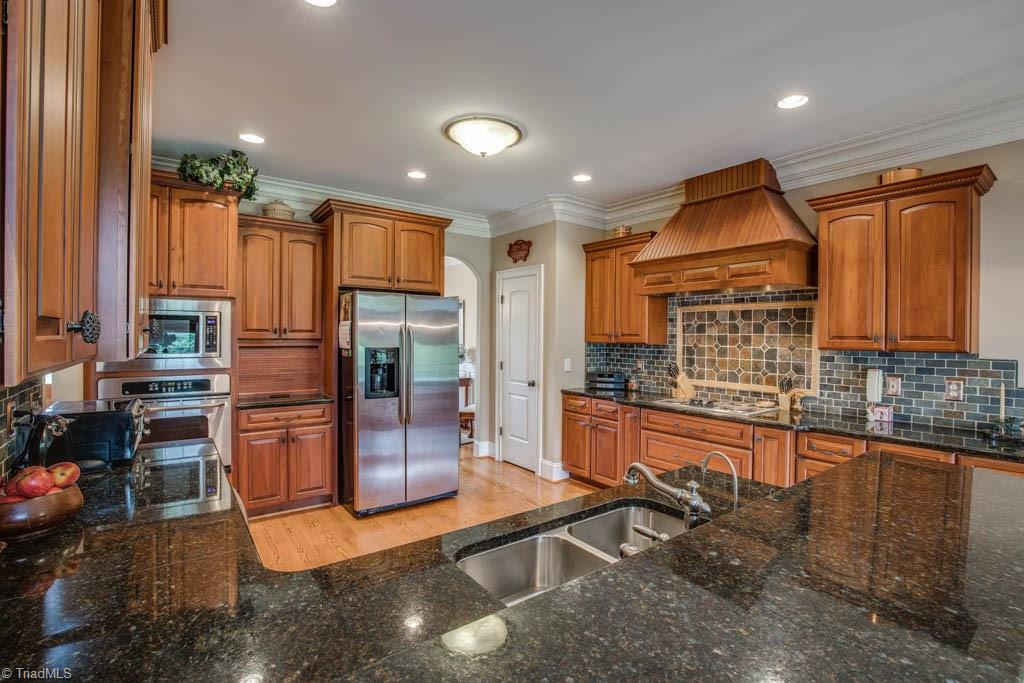 190 Baltimore Downs Road Advance, NC 27006 - Photo 5 of 30 Granite countertops, custom cherry cabinets, soft-close drawers and cabinets and separate pantry