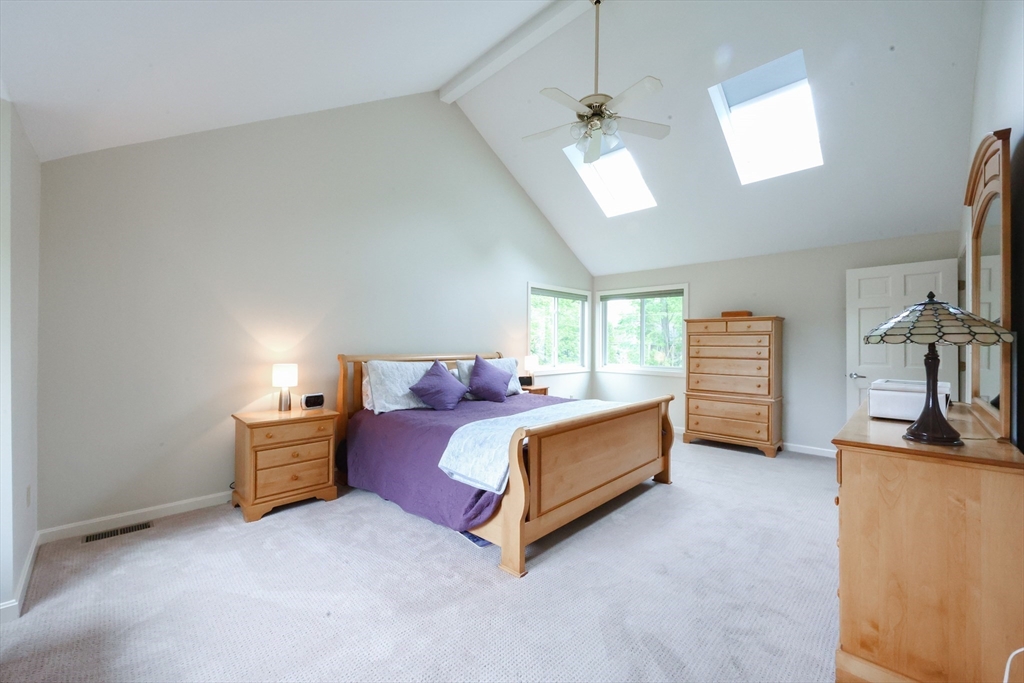 10 Grover Road Ashland, MA 01721 - Photo 14 of 41 a bed room with furniture and a flat screen tv