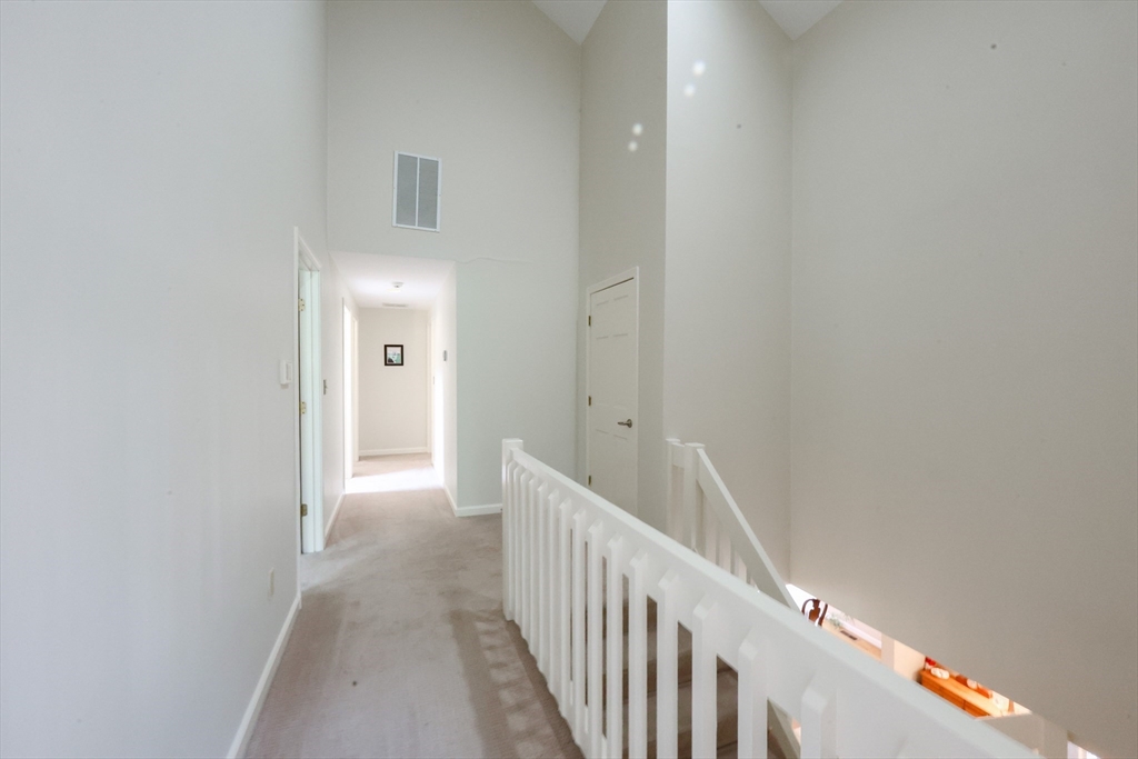 10 Grover Road Ashland, MA 01721 - Photo 16 of 41 a view of a hallway with wooden floor