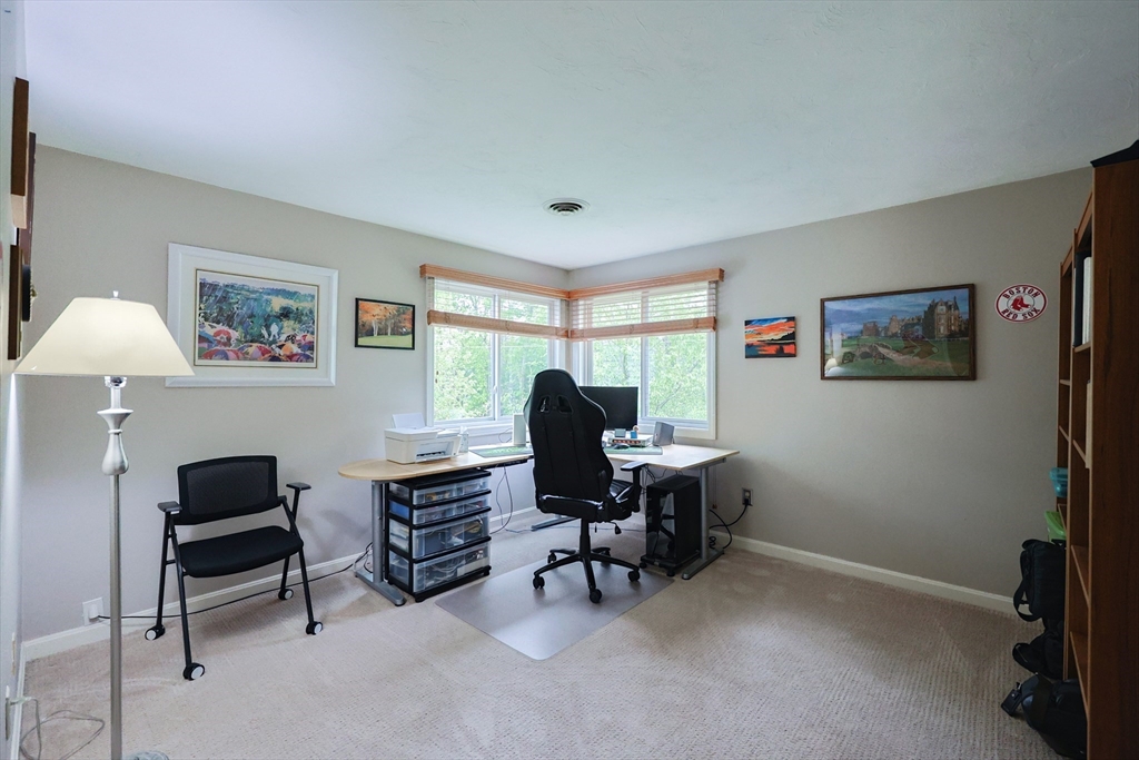10 Grover Road Ashland, MA 01721 - Photo 18 of 41 a view of a workspace with furniture and a window