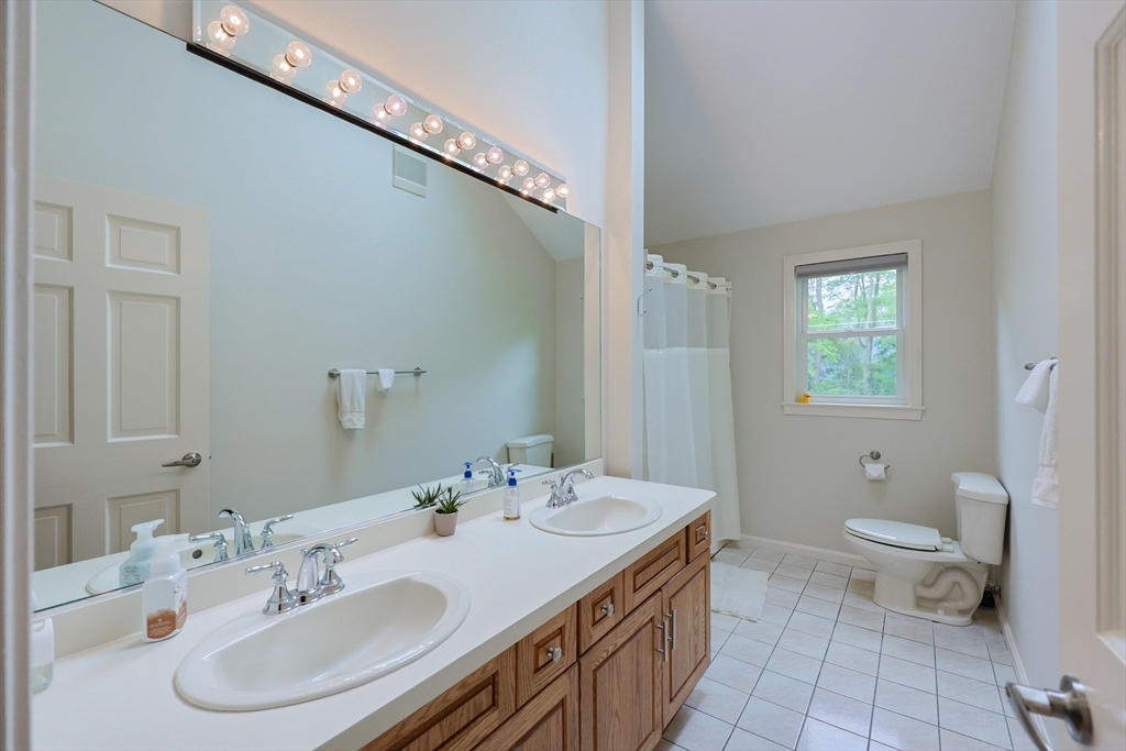 10 Grover Road Ashland, MA 01721 - Photo 19 of 41 a bathroom with a sink and a mirror