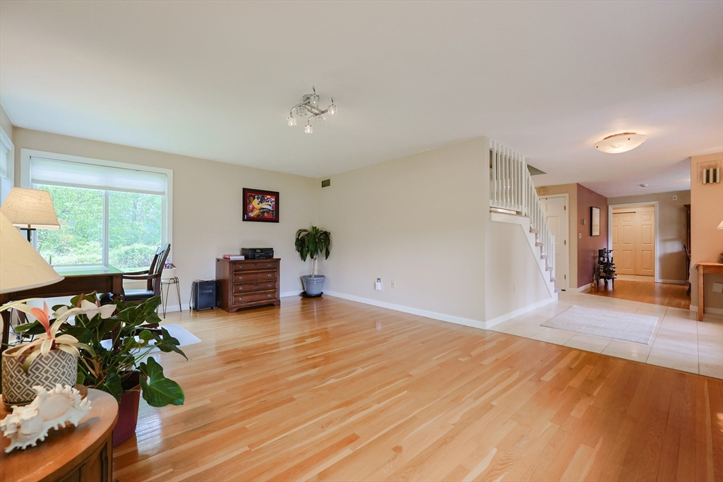 10 Grover Road Ashland, MA 01721 - Photo 24 of 41 a living room with furniture and a wooden floor