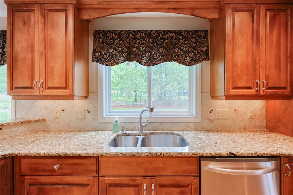 10 Grover Road Ashland, MA 01721 - Photo 29 of 41 a kitchen with granite countertop a sink window and cabinets