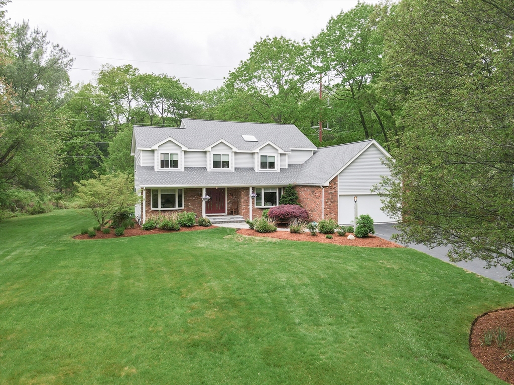 10 Grover Road Ashland, MA 01721 - Photo 3 of 41 a front view of a house with garden