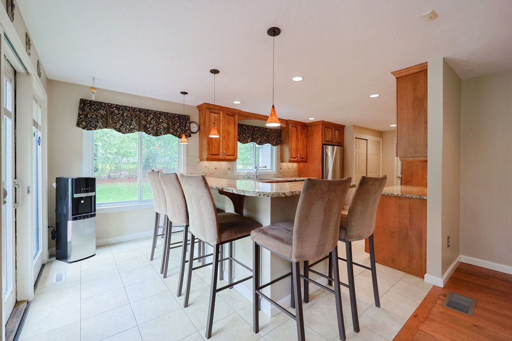 10 Grover Road Ashland, MA 01721 - Photo 32 of 41 a view of a dining room with furniture window and wooden floor