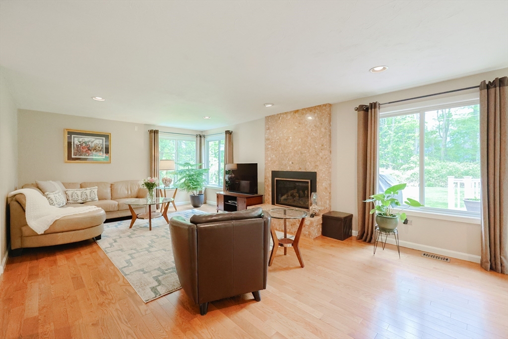 10 Grover Road Ashland, MA 01721 - Photo 33 of 41 a living room with furniture and a flat screen tv