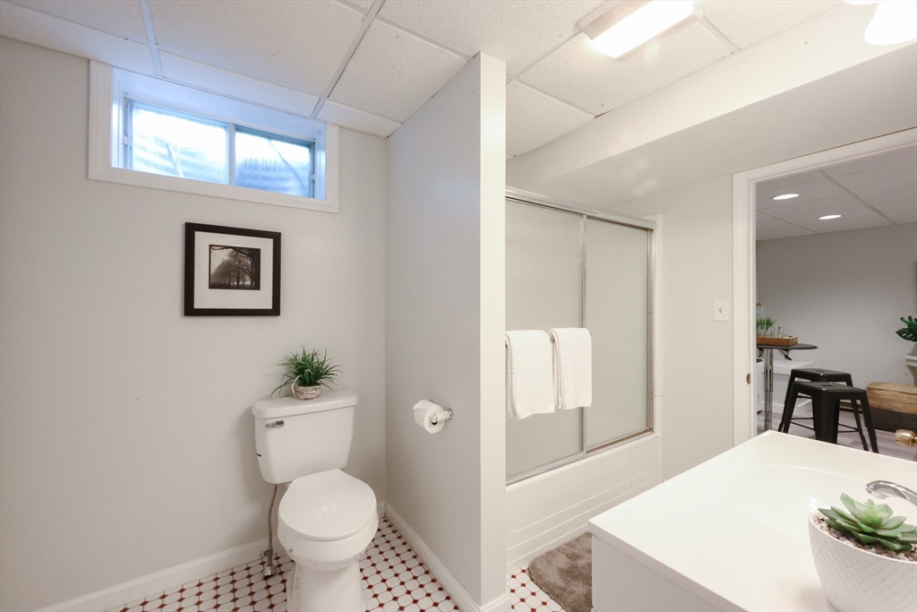 10 Grover Road Ashland, MA 01721 - Photo 38 of 41 a bathroom with a toilet sink and mirror