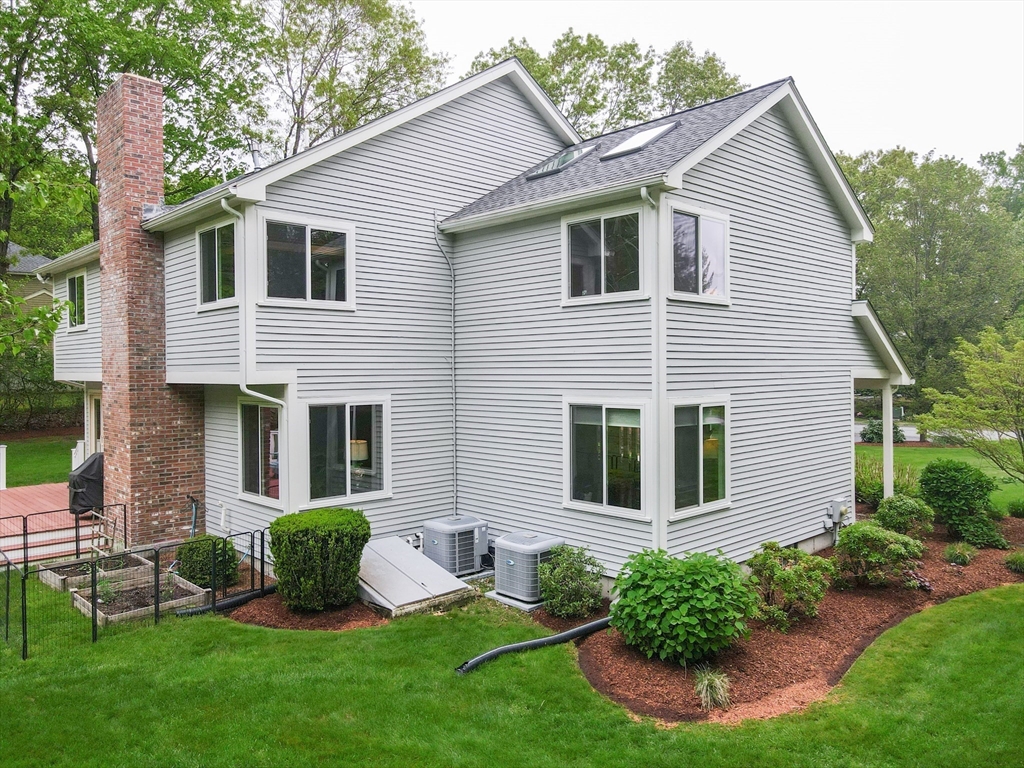 10 Grover Road Ashland, MA 01721 - Photo 6 of 41 a view of a house with a yard and plants