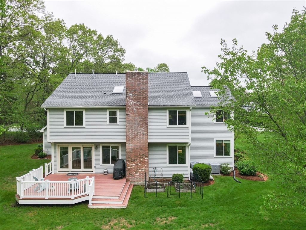 10 Grover Road Ashland, MA 01721 - Photo 7 of 41 a view of house with garden and deck