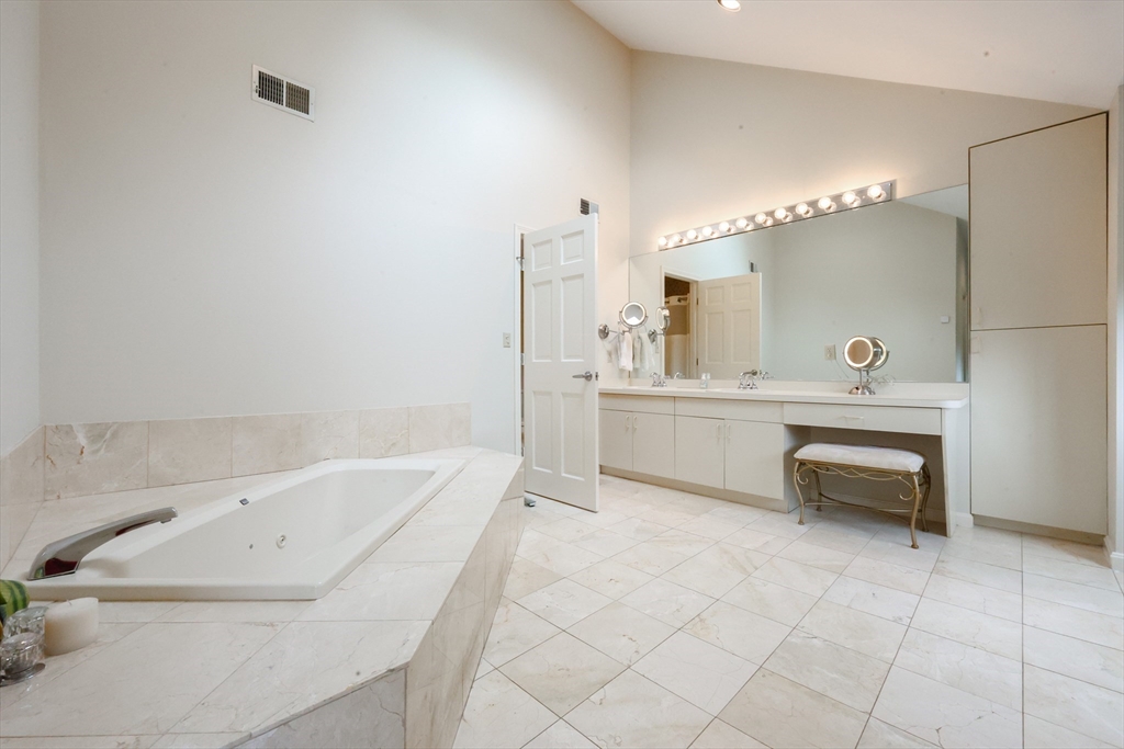 10 Grover Road Ashland, MA 01721 - Photo 8 of 41 a bathroom with a bathtub sink and toilet