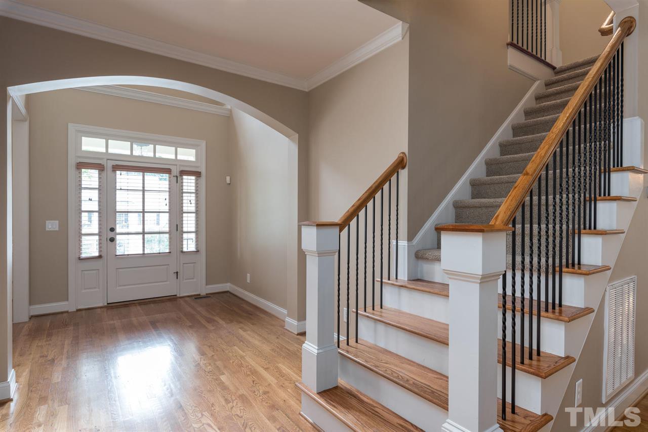 11511 Azari Court Raleigh, NC 27614 - Photo 2 of 25 an empty room with wooden floor and windows