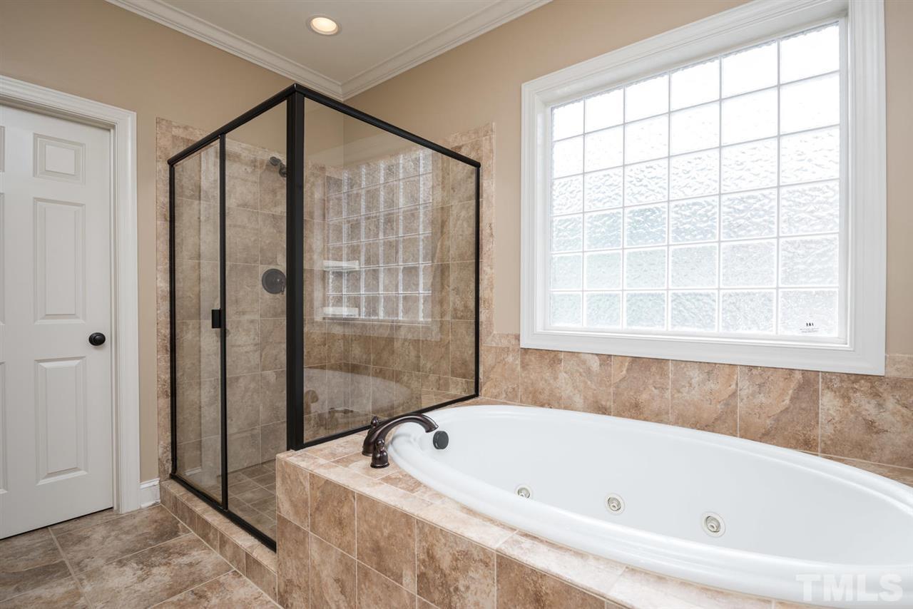 11511 Azari Court Raleigh, NC 27614 - Photo 14 of 25 a bathroom with a bathtub and a shower