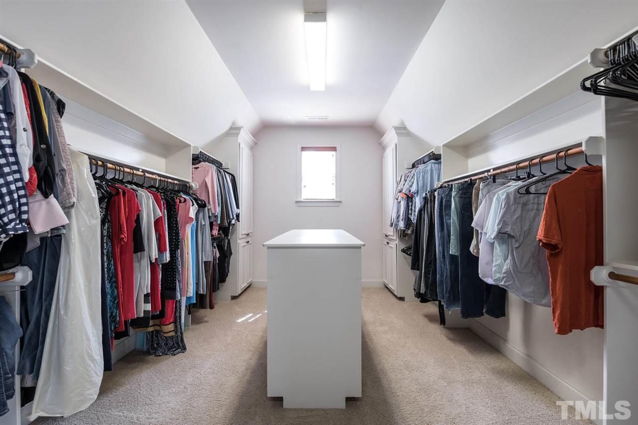 11511 Azari Court Raleigh, NC 27614 - Photo 15 of 25 a view of walk in closet with clothes and shoes