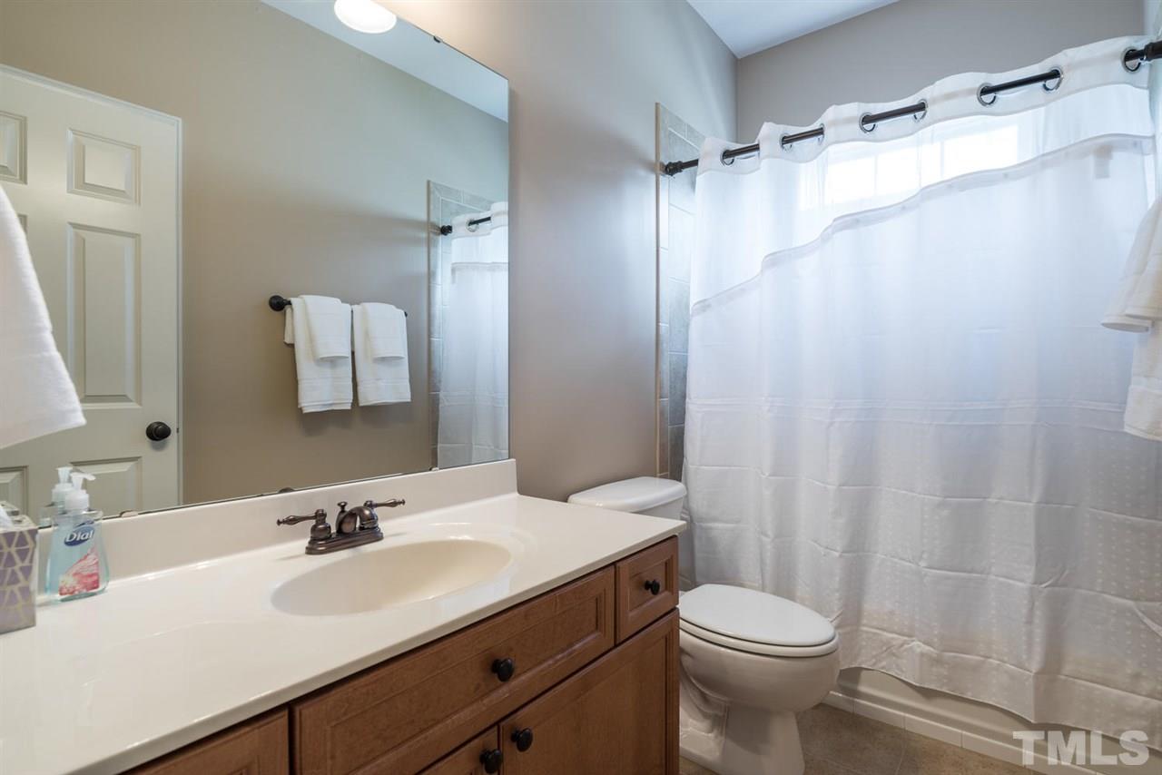 11511 Azari Court Raleigh, NC 27614 - Photo 17 of 25 a bathroom with a sink toilet and shower
