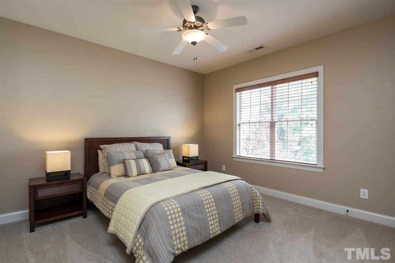 11511 Azari Court Raleigh, NC 27614 - Photo 18 of 25 a bedroom with a bed and a window