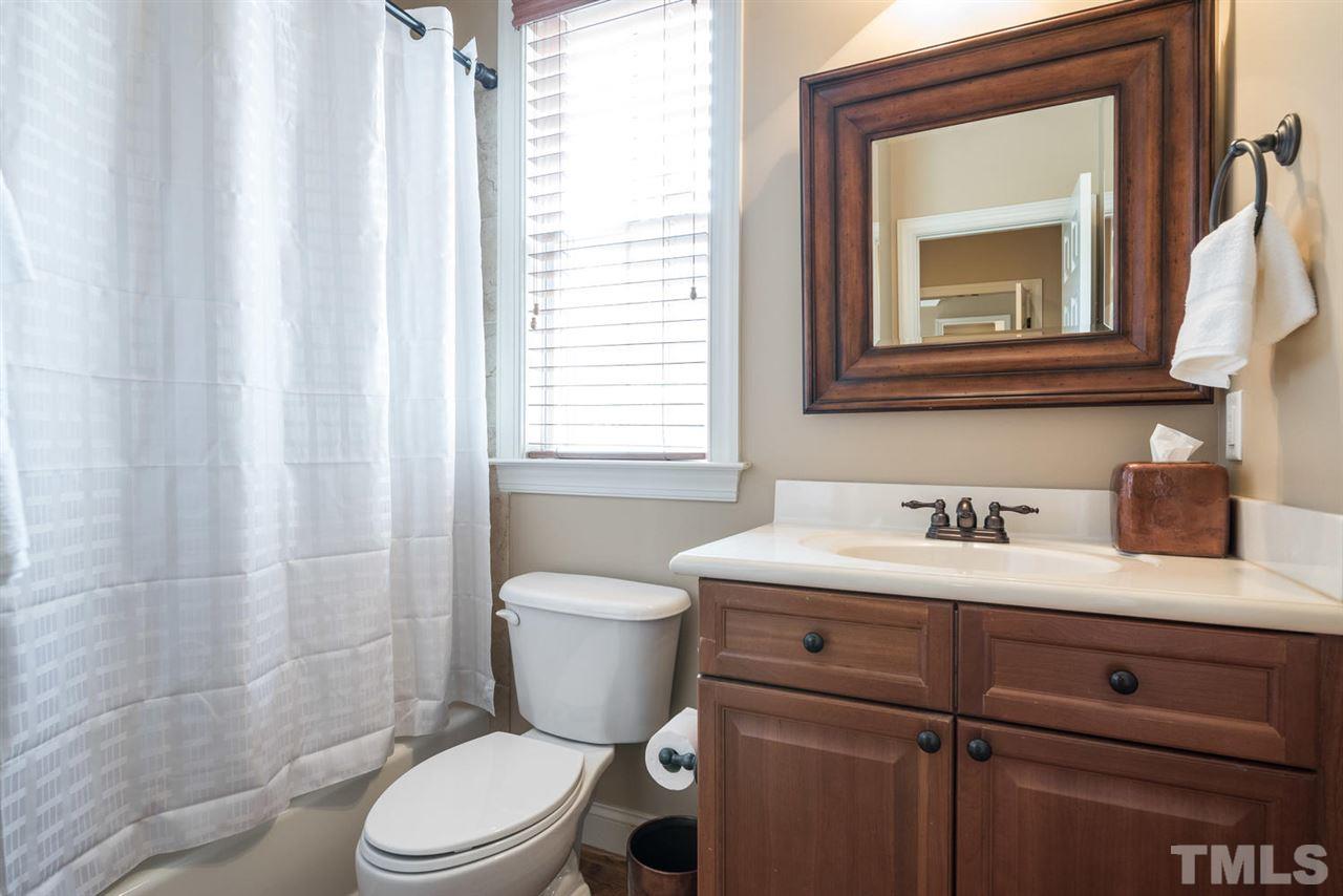11511 Azari Court Raleigh, NC 27614 - Photo 20 of 25 a bathroom with a toilet a sink and a mirror