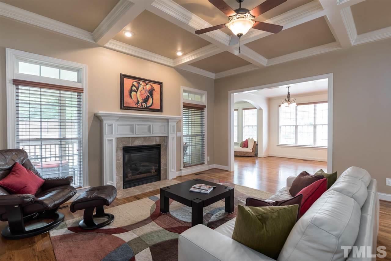 11511 Azari Court Raleigh, NC 27614 - Photo 5 of 25 a living room with furniture a fireplace and a large window