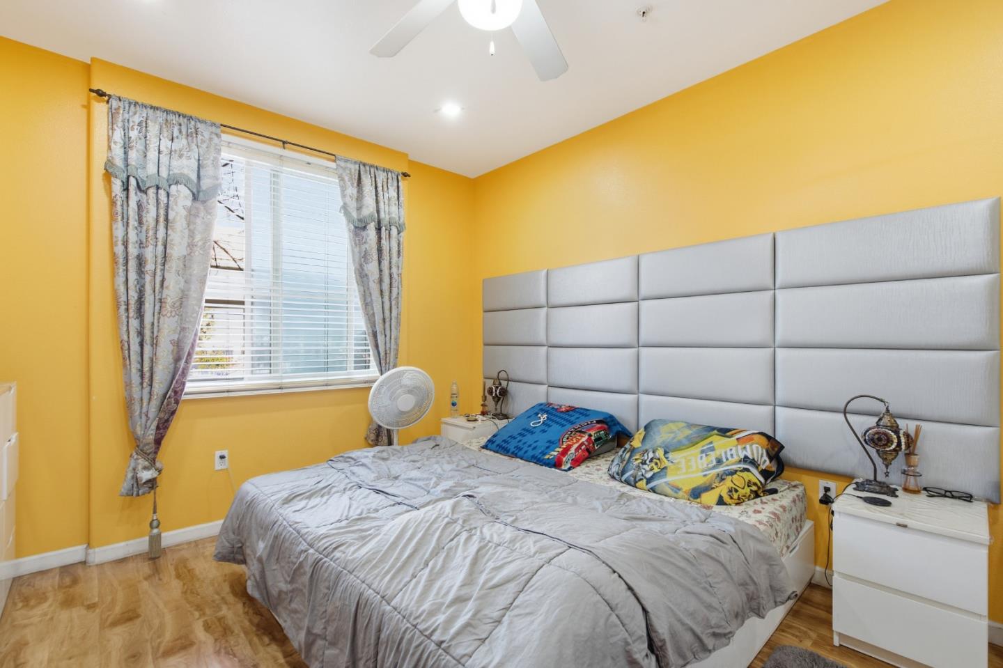 1101 South Main Street, Unit 212 Milpitas, CA 95035 - Photo 11 of 24 a bedroom with a bed and a window
