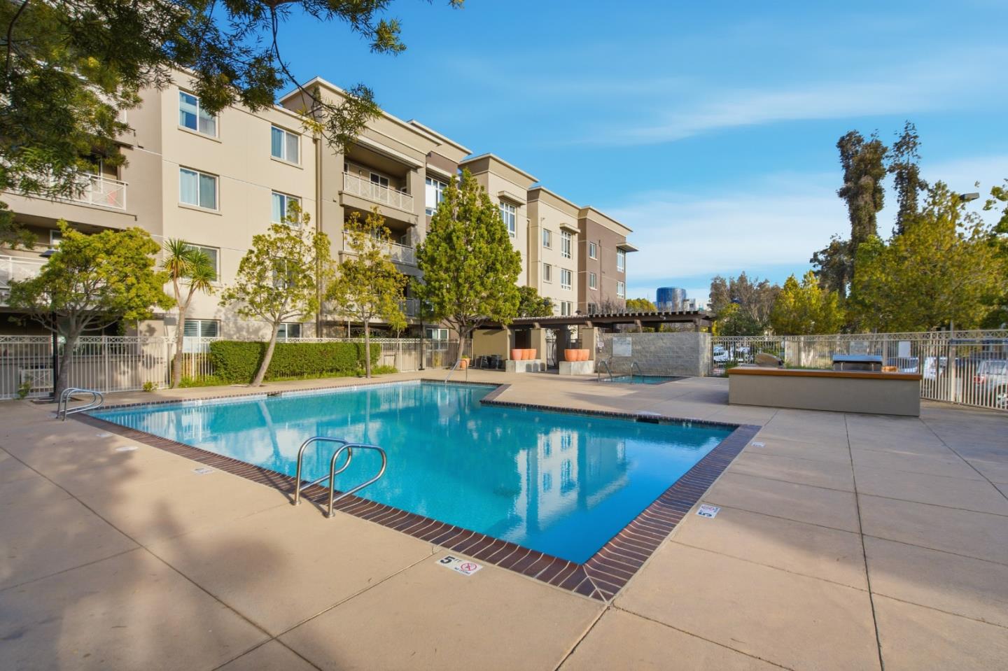 1101 South Main Street, Unit 212 Milpitas, CA 95035 - Photo 21 of 24 a view of a swimming pool with a lounge chairs