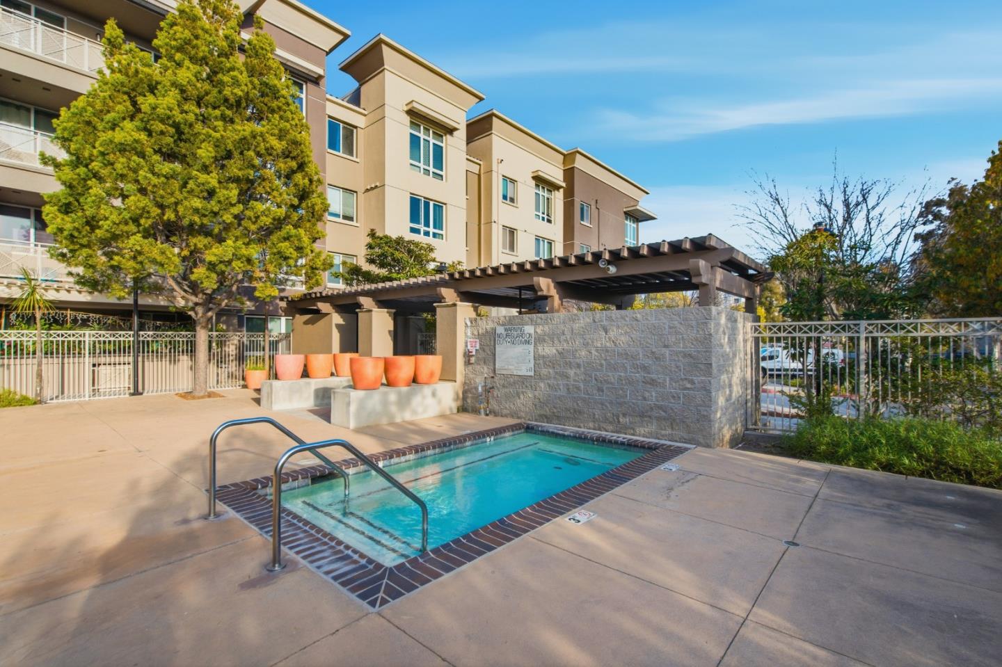 1101 South Main Street, Unit 212 Milpitas, CA 95035 - Photo 23 of 24 a front view of a house with garden