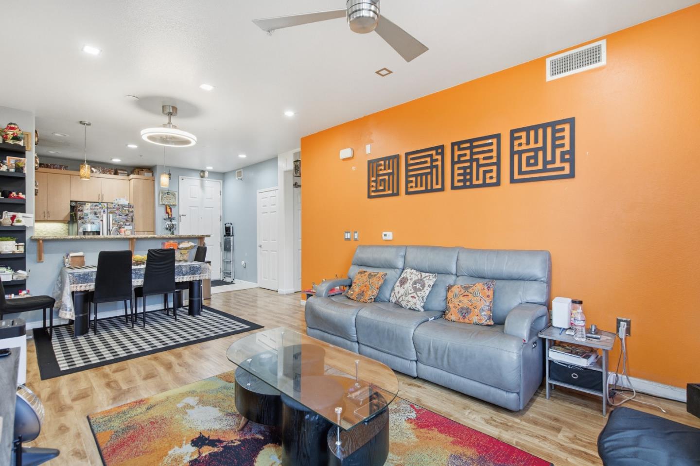 1101 South Main Street, Unit 212 Milpitas, CA 95035 - Photo 5 of 24 a living room with furniture and a wooden floor