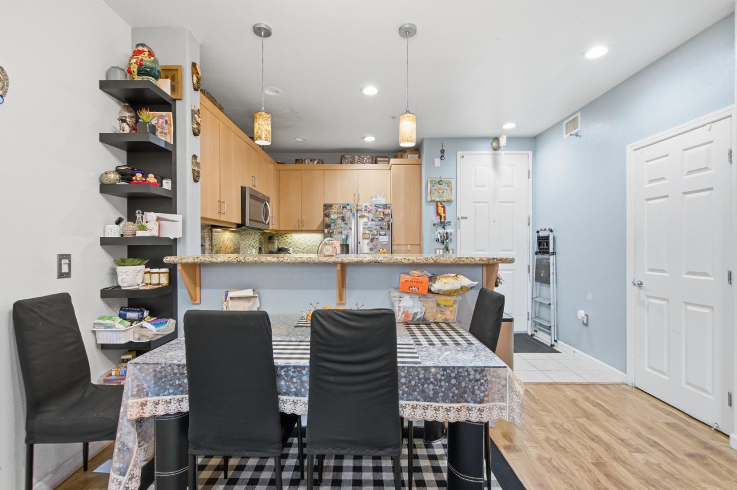 1101 South Main Street, Unit 212 Milpitas, CA 95035 - Photo 6 of 24 a dining room with furniture and a floor to ceiling window