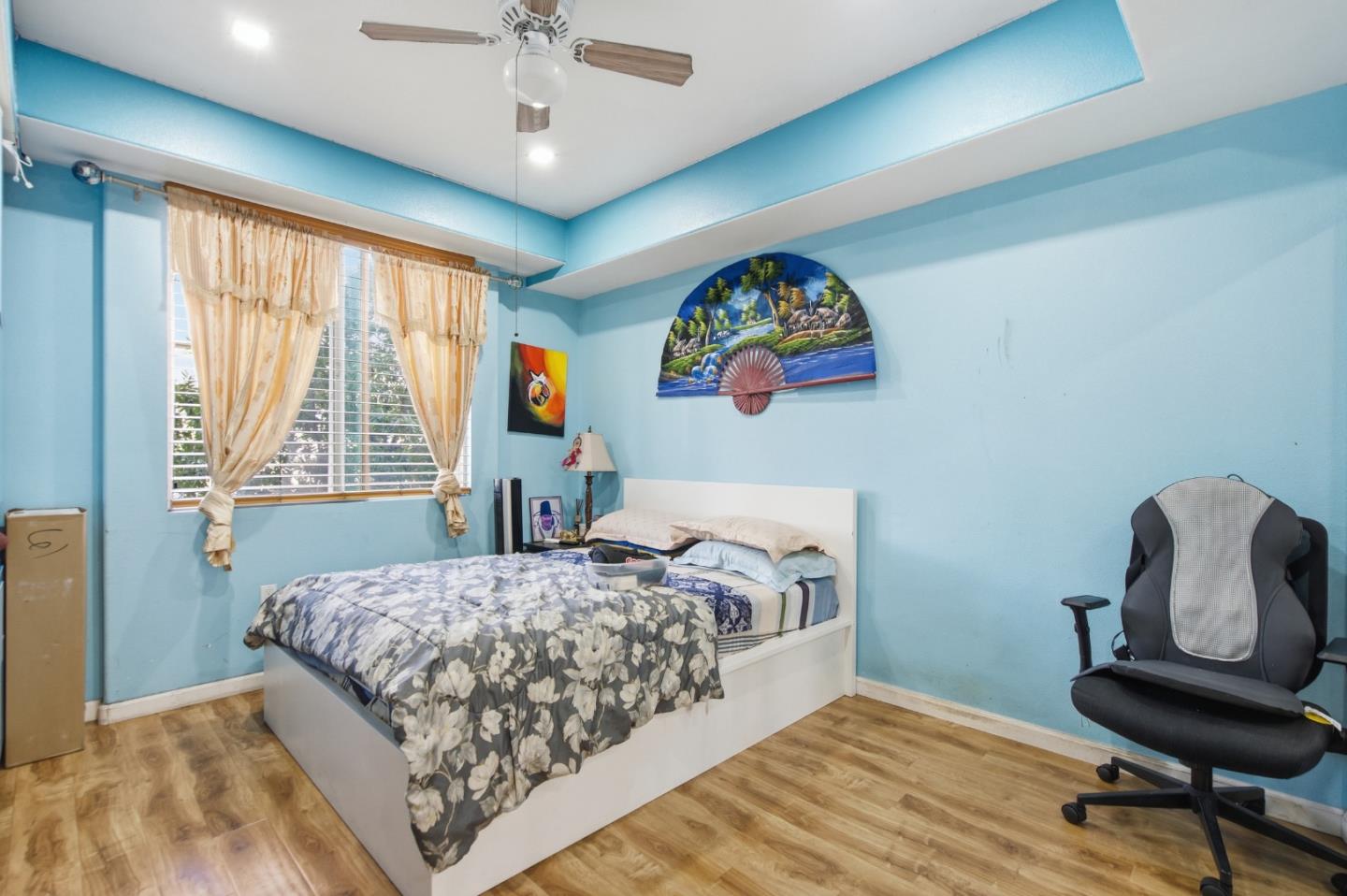 1101 South Main Street, Unit 212 Milpitas, CA 95035 - Photo 8 of 24 a bedroom with a bed and a chair