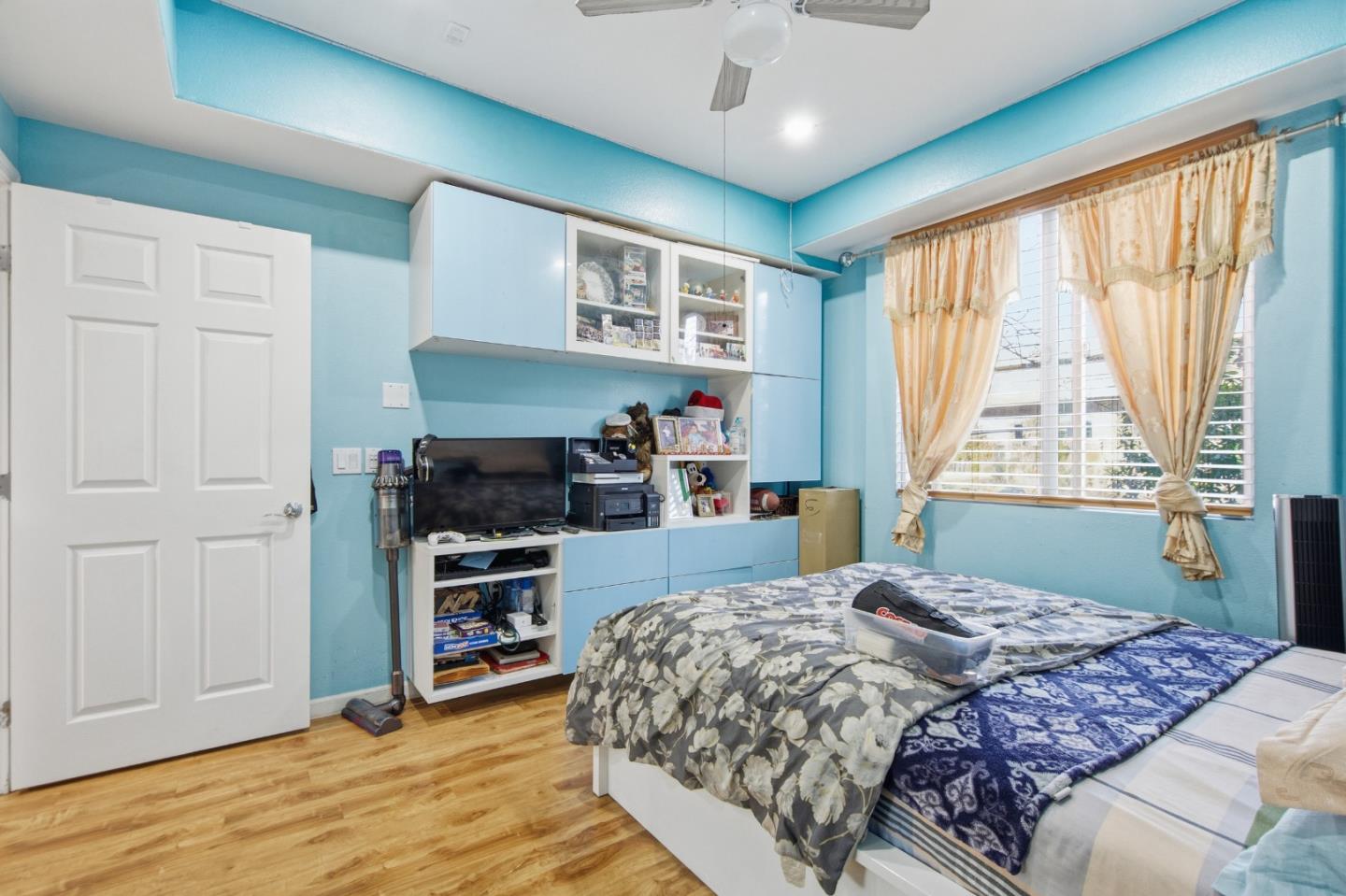 1101 South Main Street, Unit 212 Milpitas, CA 95035 - Photo 9 of 24 a bedroom with a large bed and a window