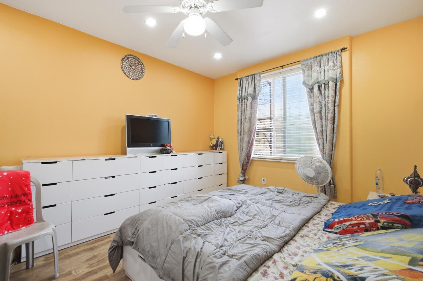 1101 South Main Street, Unit 212 Milpitas, CA 95035 - Photo 10 of 24 a bedroom with a bed and a window