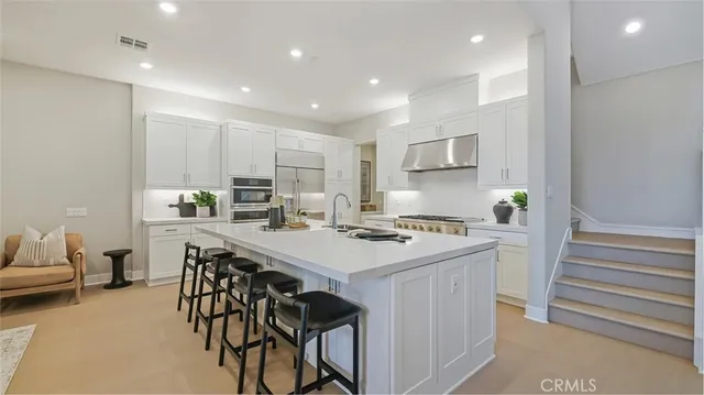 a kitchen that has a cabinets and a stove in it