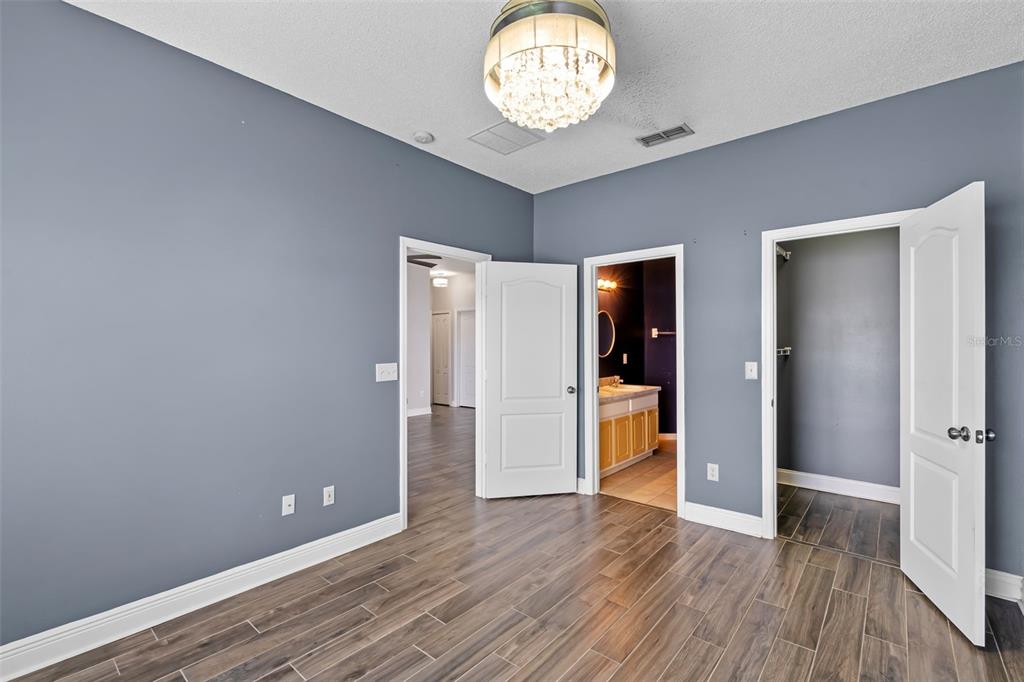 4784 Waterside Pointe Circle Orlando, FL 32829 - Photo 26 of 31 a view of an empty room with wooden floor