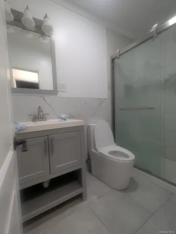 a view of an empty room and wooden floor