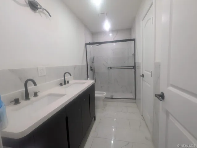 a bathroom with a sink and mirror