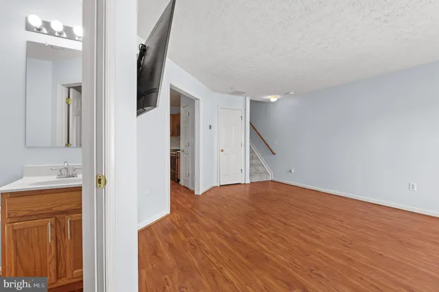 a view of a bedroom from a hallway