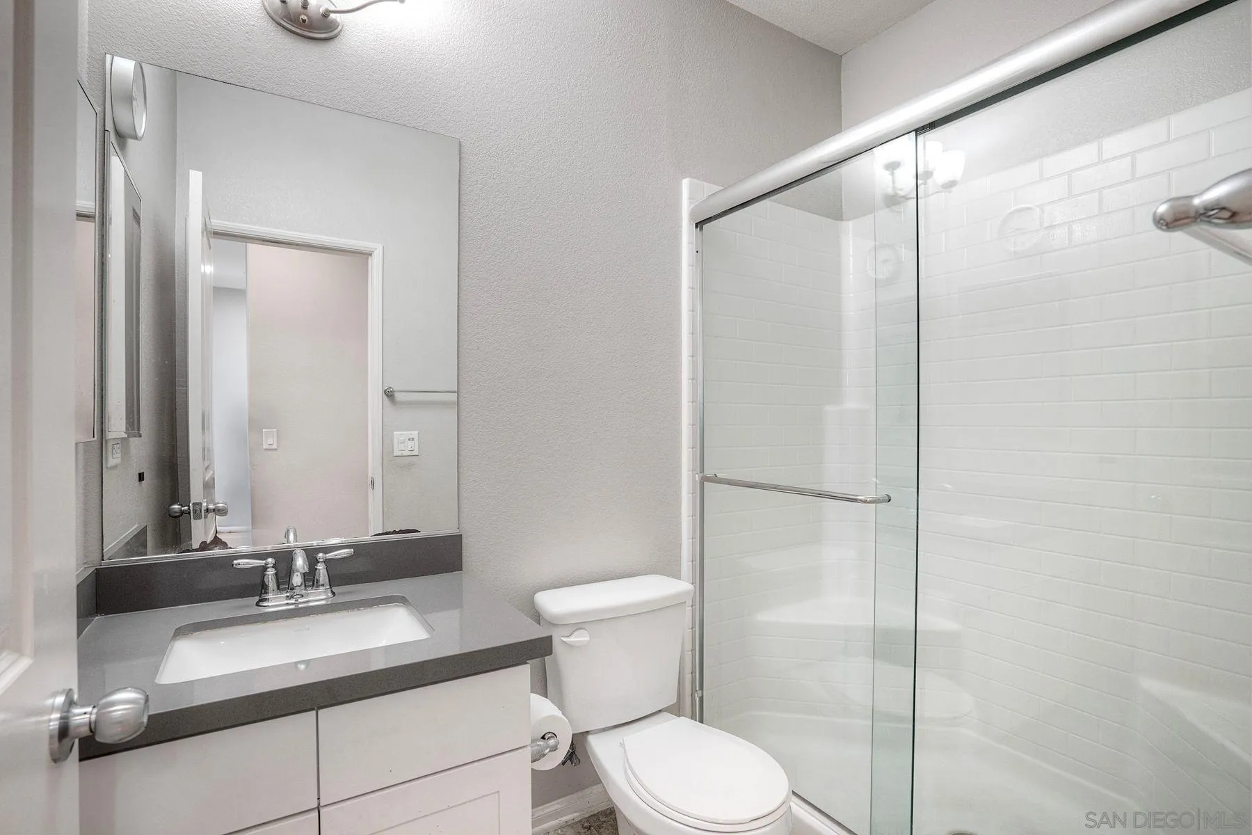 8850 Olive Lane, Unit 7 Santee, CA 92071 - Photo 12 of 27 a bathroom with a granite countertop sink toilet and shower
