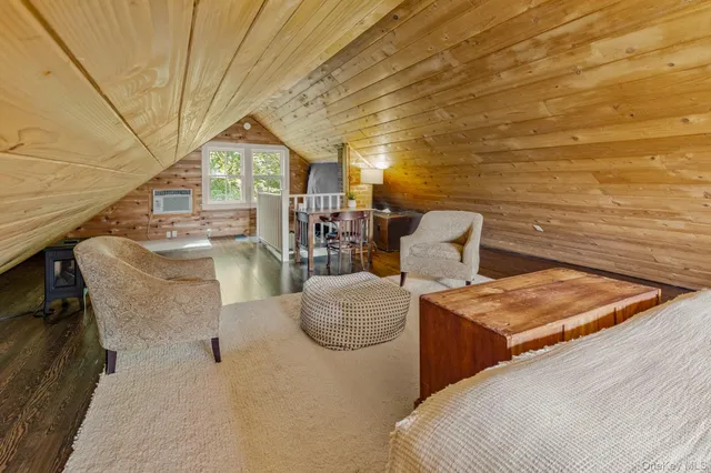 a bedroom with furniture and window