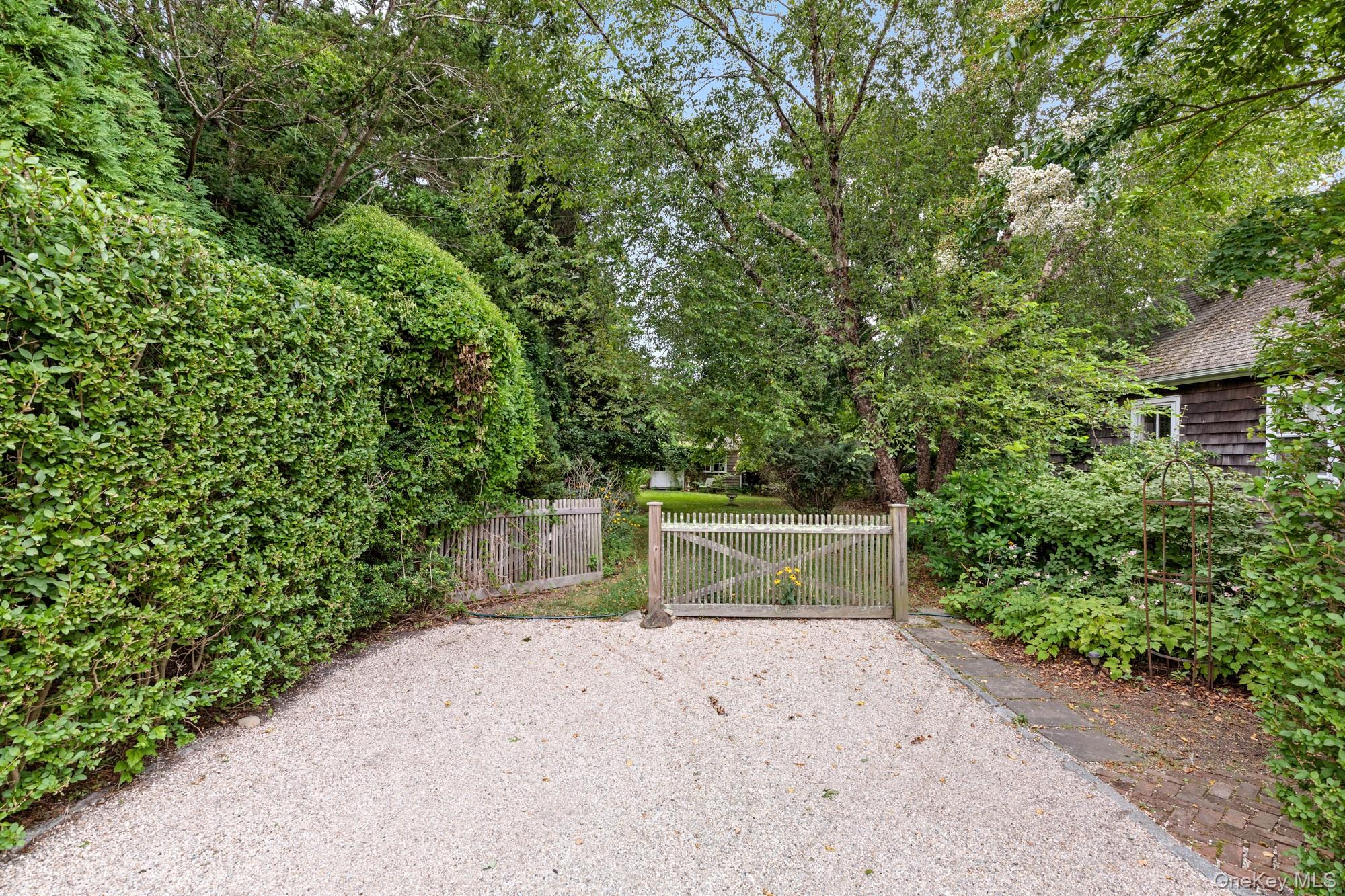 10 Pleasant Lane East Hampton, NY 11937 - Photo 4 of 15 a view of a garage with a tree