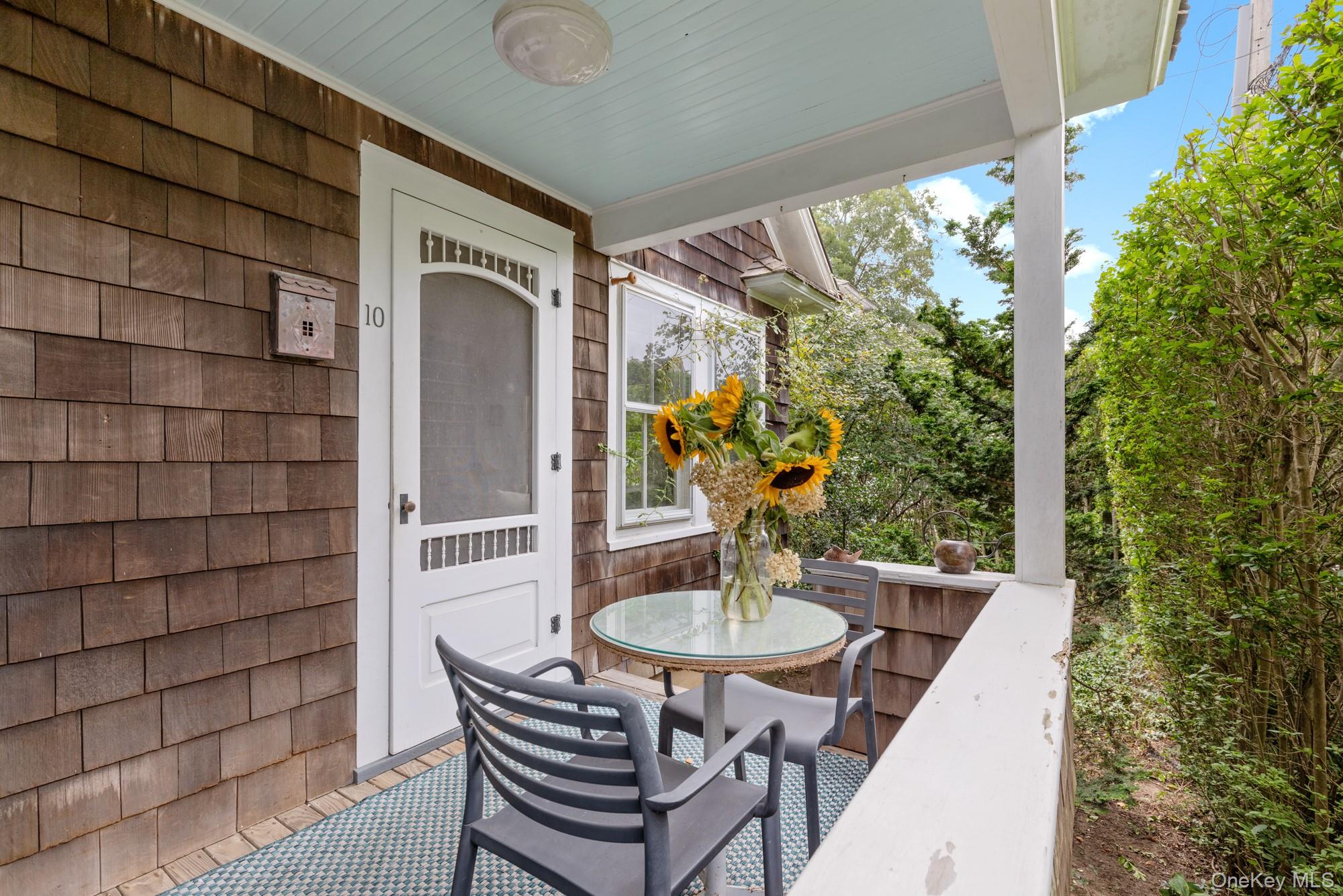 10 Pleasant Lane East Hampton, NY 11937 - Photo 5 of 15 a outdoor dining space with furniture and outdoor view