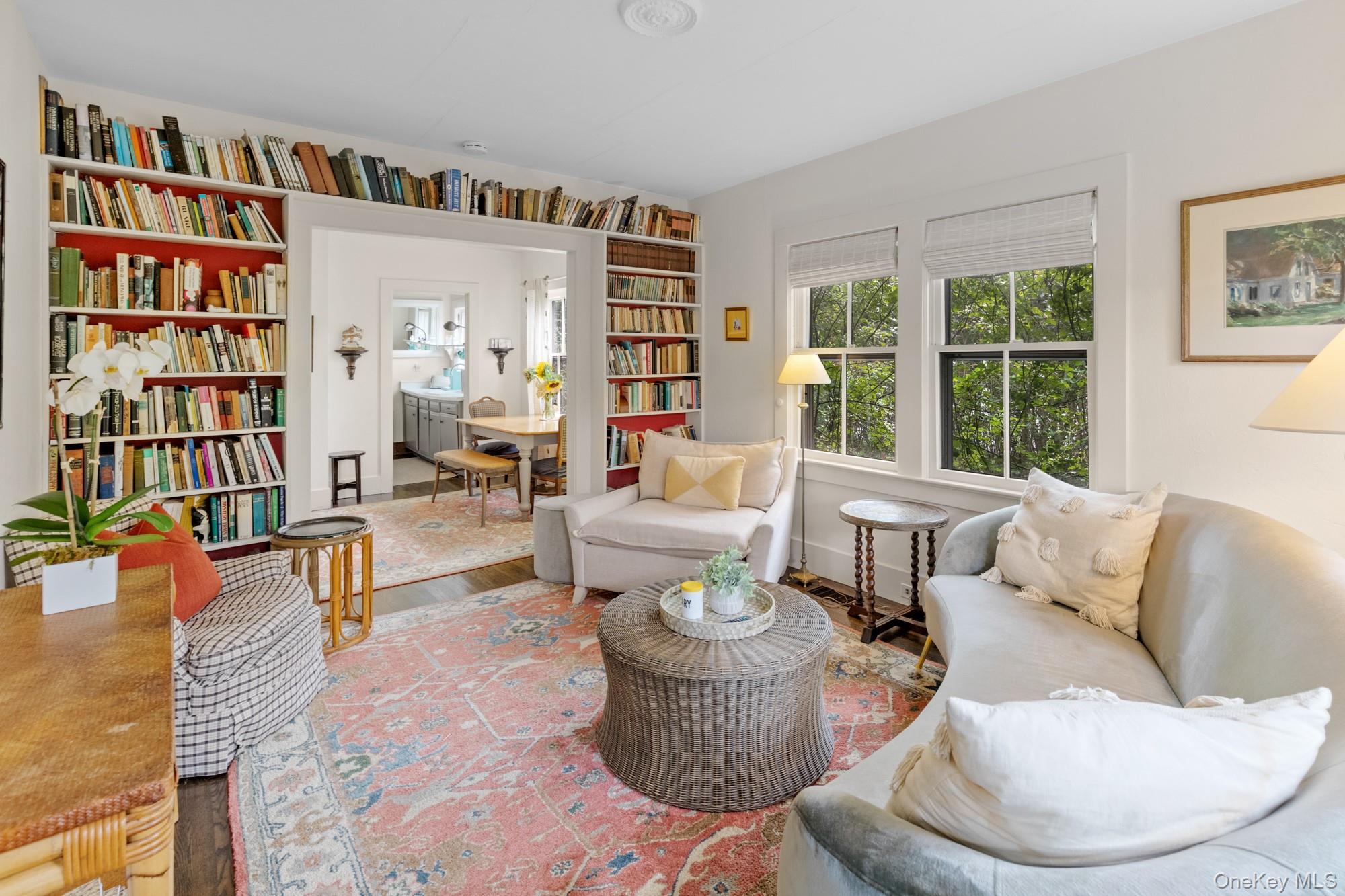 10 Pleasant Lane East Hampton, NY 11937 - Photo 6 of 15 a living room with furniture and a book shelf