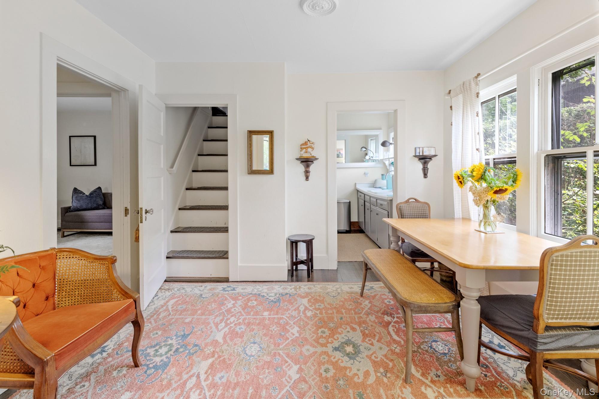 10 Pleasant Lane East Hampton, NY 11937 - Photo 7 of 15 a view of a livingroom with furniture and staircase